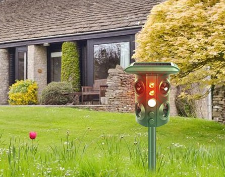 The repeller flashing red on a farmhouse lawn